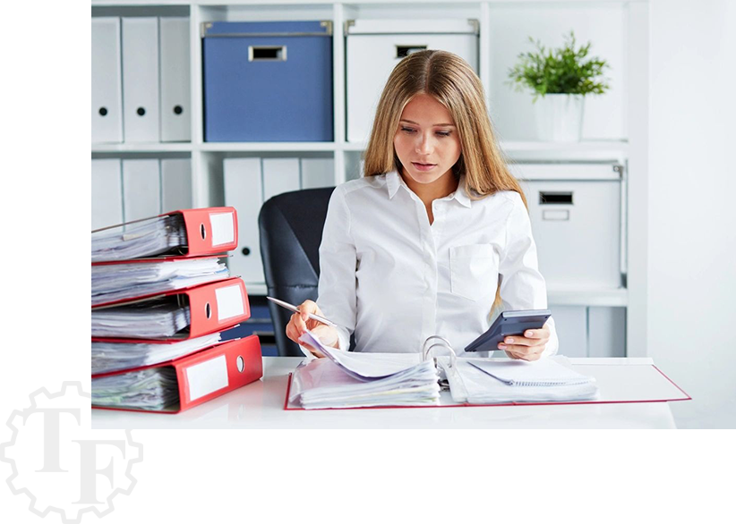 A girl checking the documents with a calculator in hand